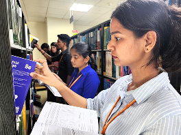 Student browsing books at the library