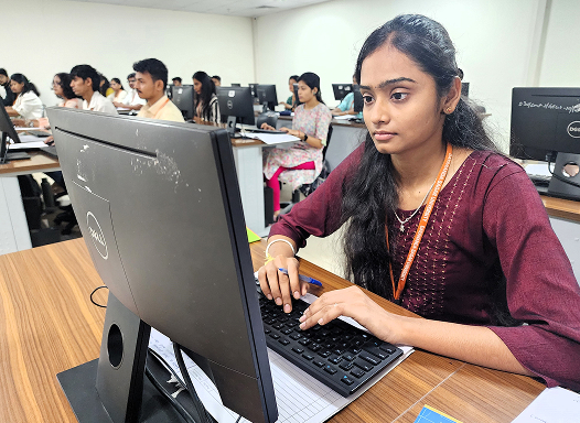 Student working at a computer workstation in a lab